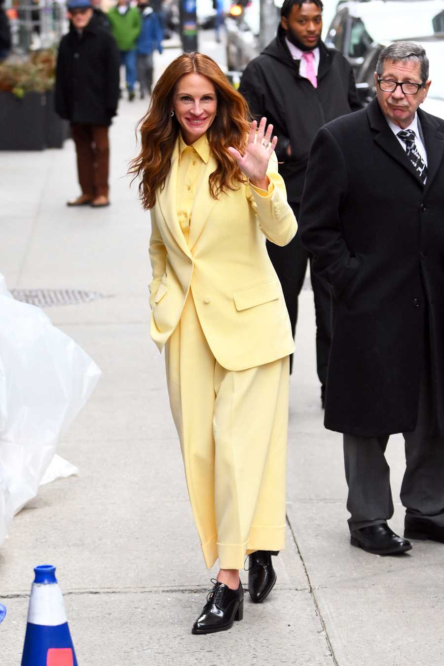 Julia Roberts brings color to the streets of New York with this yellow Gucci suit